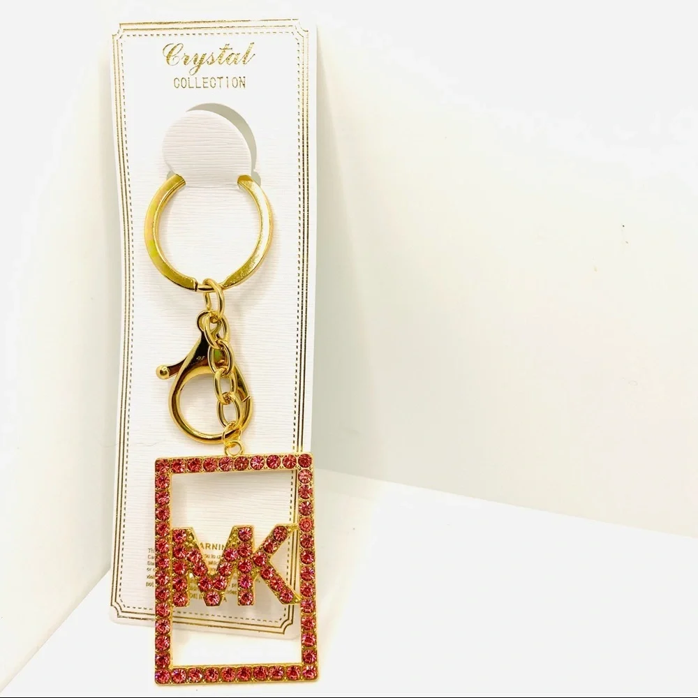 Purse Charm Key Chain MK Pink Crystals set in golden tone. BRAND NEW